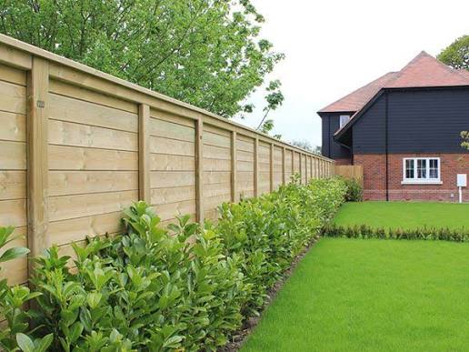 Garden with fencing and hedge kept tidy
