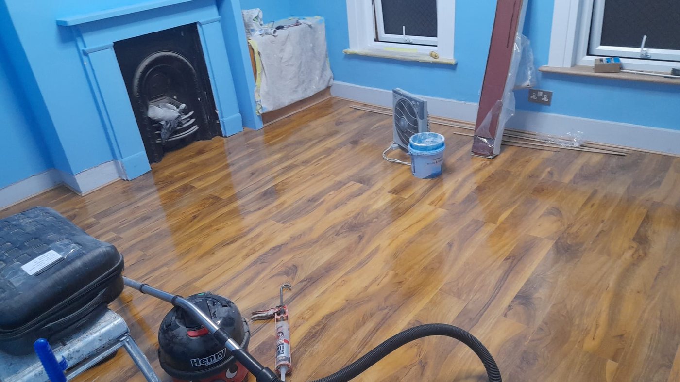 New wood effect laminate flooring laid in a period front room